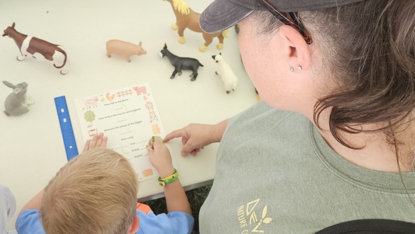Parent and child at Shiawassee County Fair activity